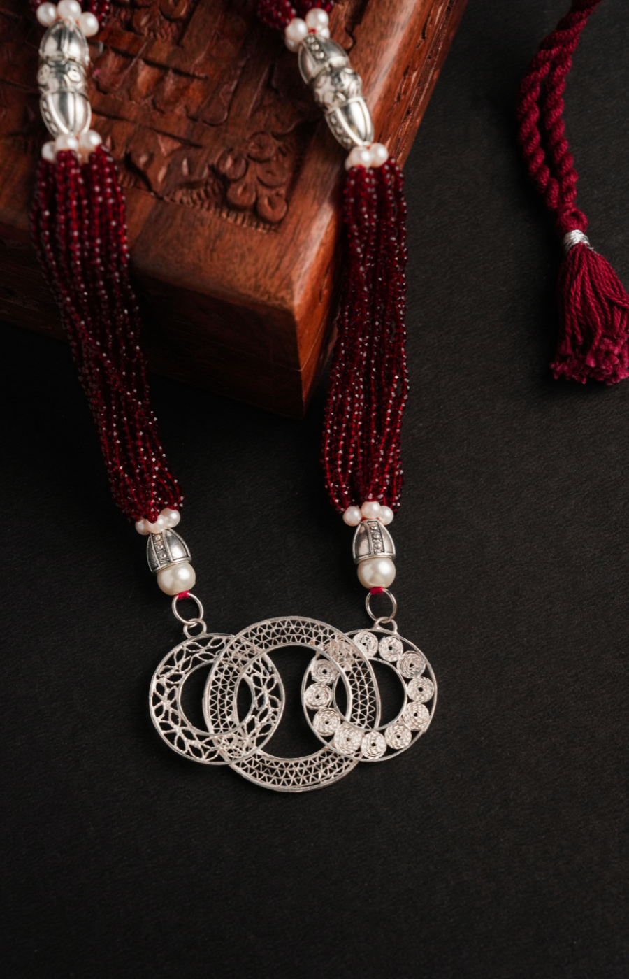 Ring Shaped Pendant with Red Pearls